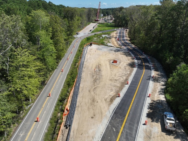 Aerial view of new bypass road for the Elbow Road project looking towards the new bridge site